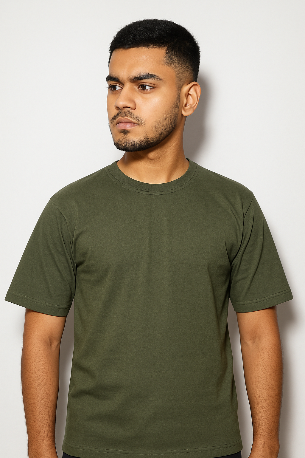 Man wearing a green t-shirt against a white background