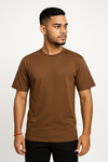 Man wearing a brown t-shirt on a white background