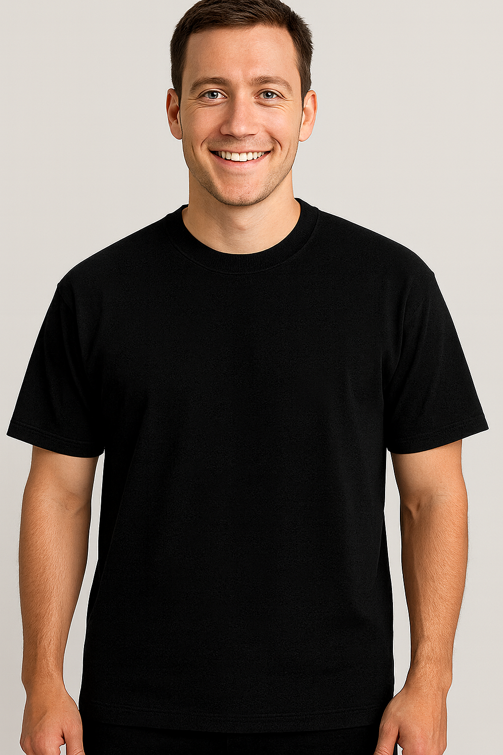 Man wearing a black t-shirt against a plain background