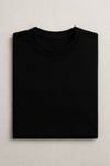Folded black t-shirt on a light gray background