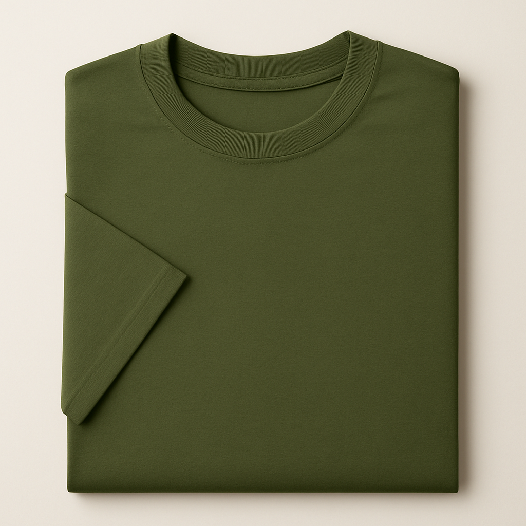 Folded green t-shirt on a beige background