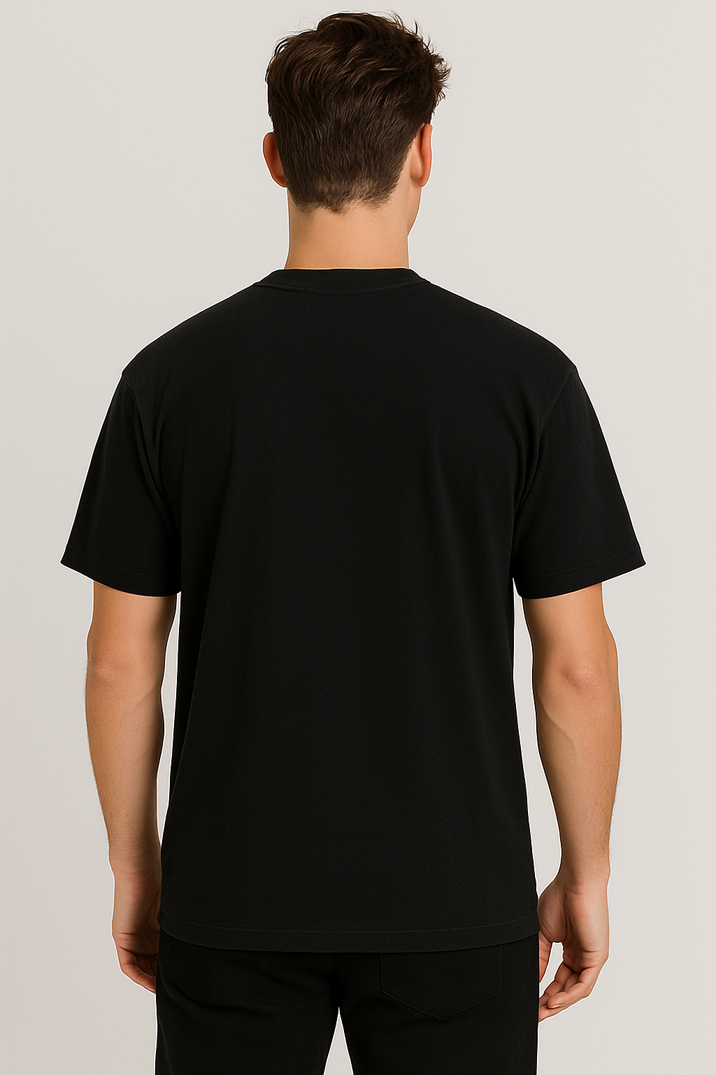 Person wearing a black t-shirt on a light gray background